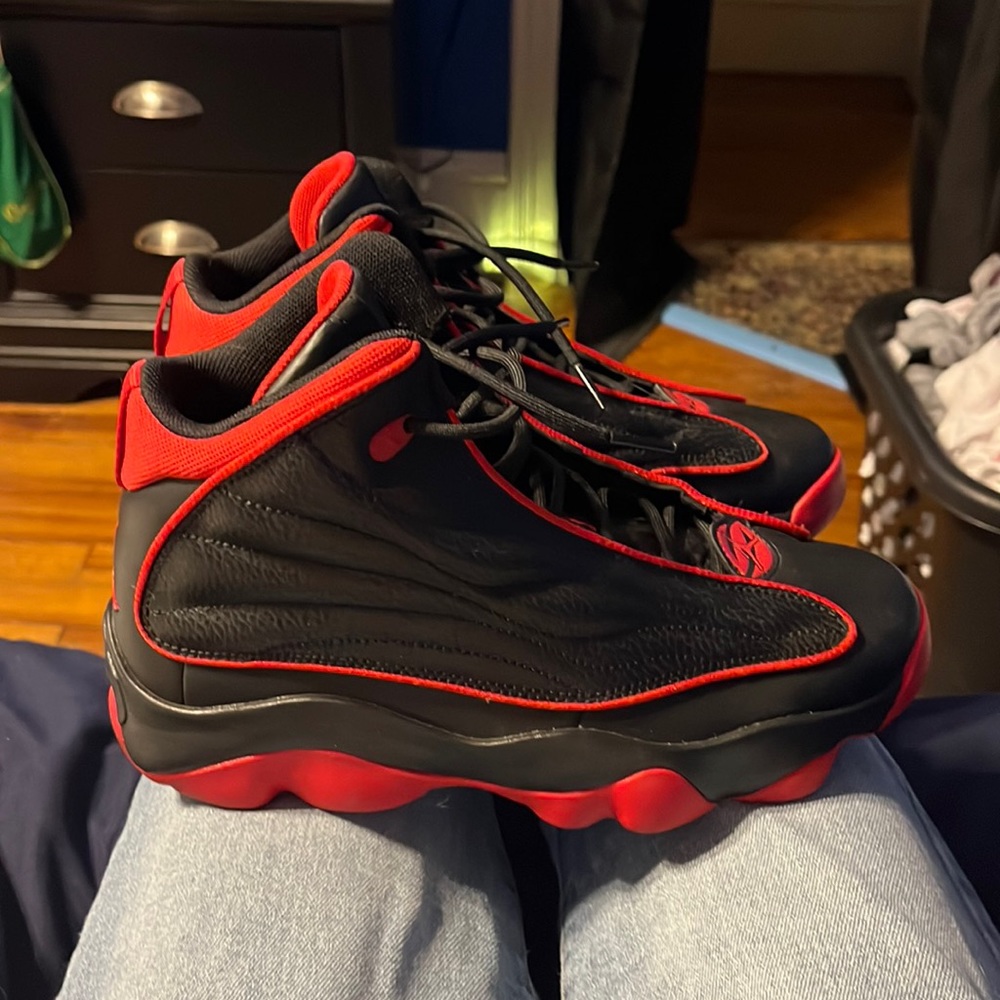 black and red jordan 13’s